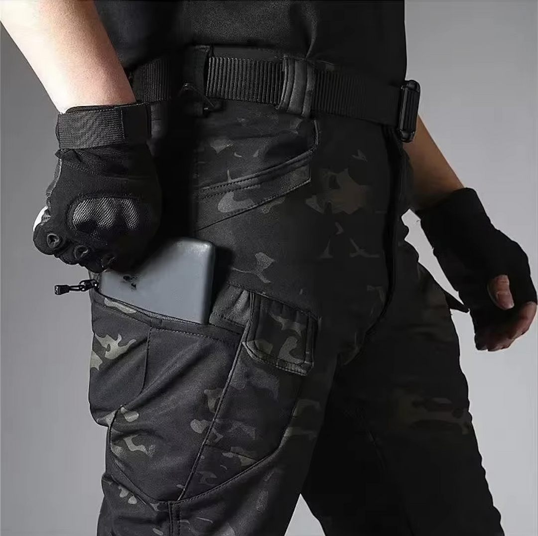 Robust men's outdoor waterproof softshell jacket & tactical pants set for adventure seekers.