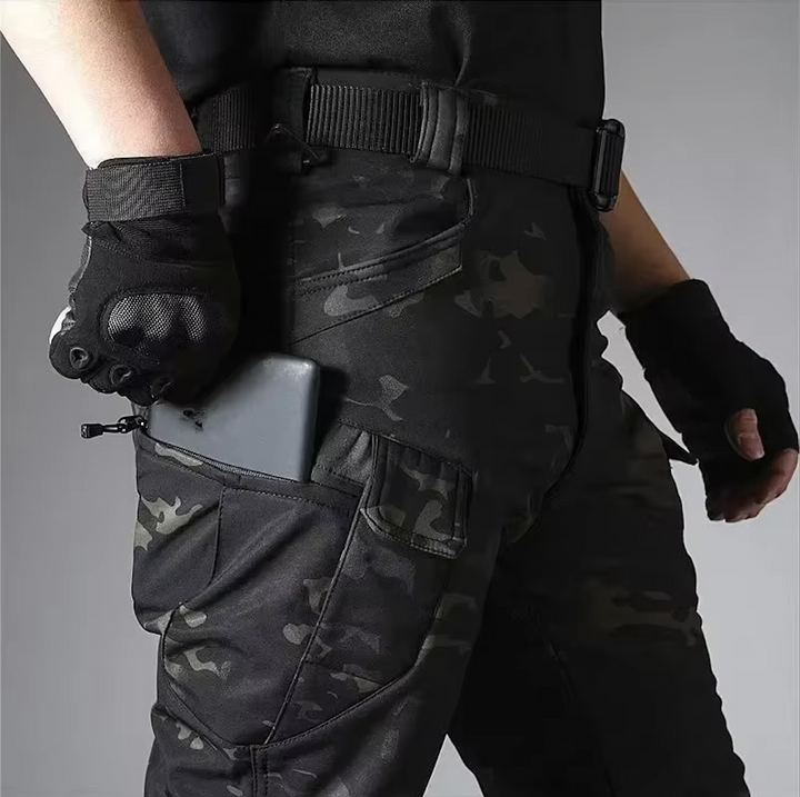 Robust men's outdoor waterproof softshell jacket & tactical pants set for adventure seekers.
