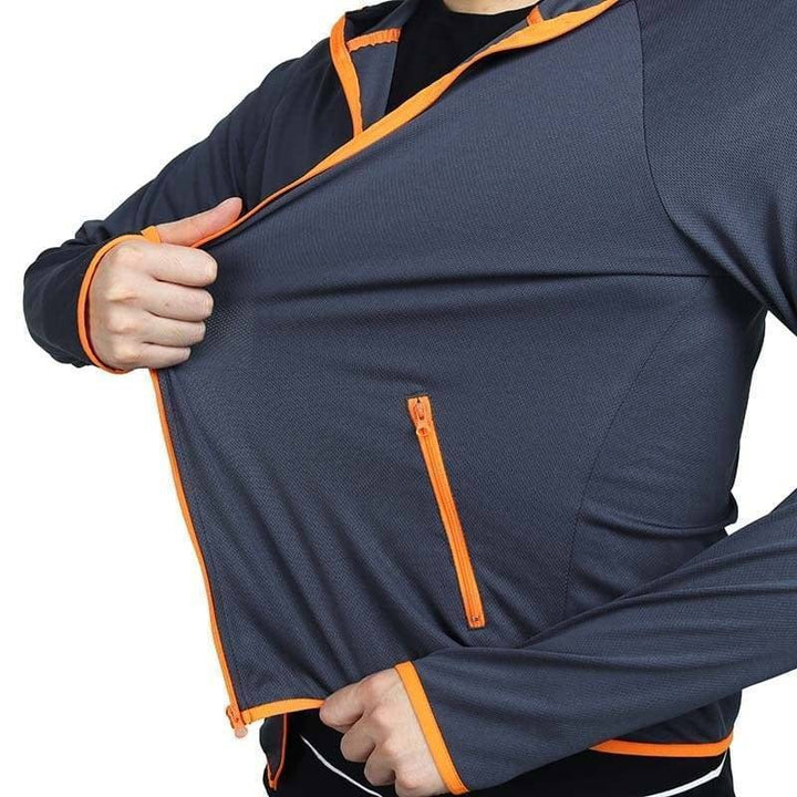 Man hiking in versatile windproof & water-repellent outdoor jacket. Breathable all-weather activewear.