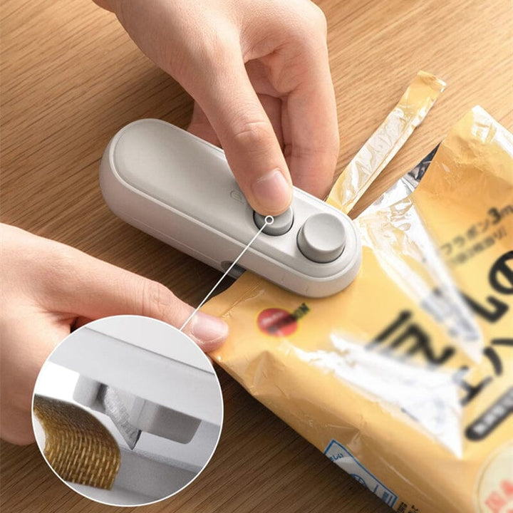 Mini handheld USB rechargeable bag sealer with built-in cutter, perfect for food preservation and snack bags