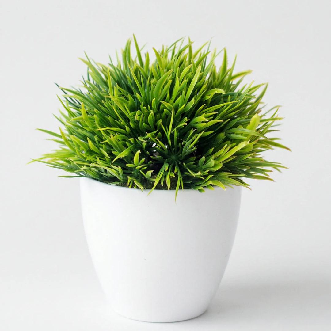 Small artificial tree, sculpted and lifelike. Great for home, office, desk decor.