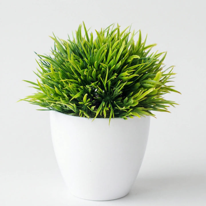 Small artificial tree, sculpted and lifelike. Great for home, office, desk decor.
