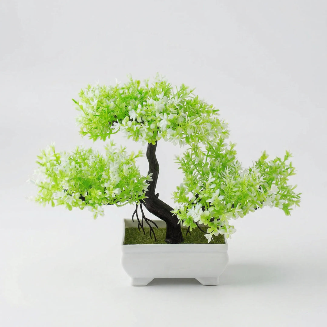 Faux tabletop tree, an artificial plant adding maintenance-free greenery to your desk.