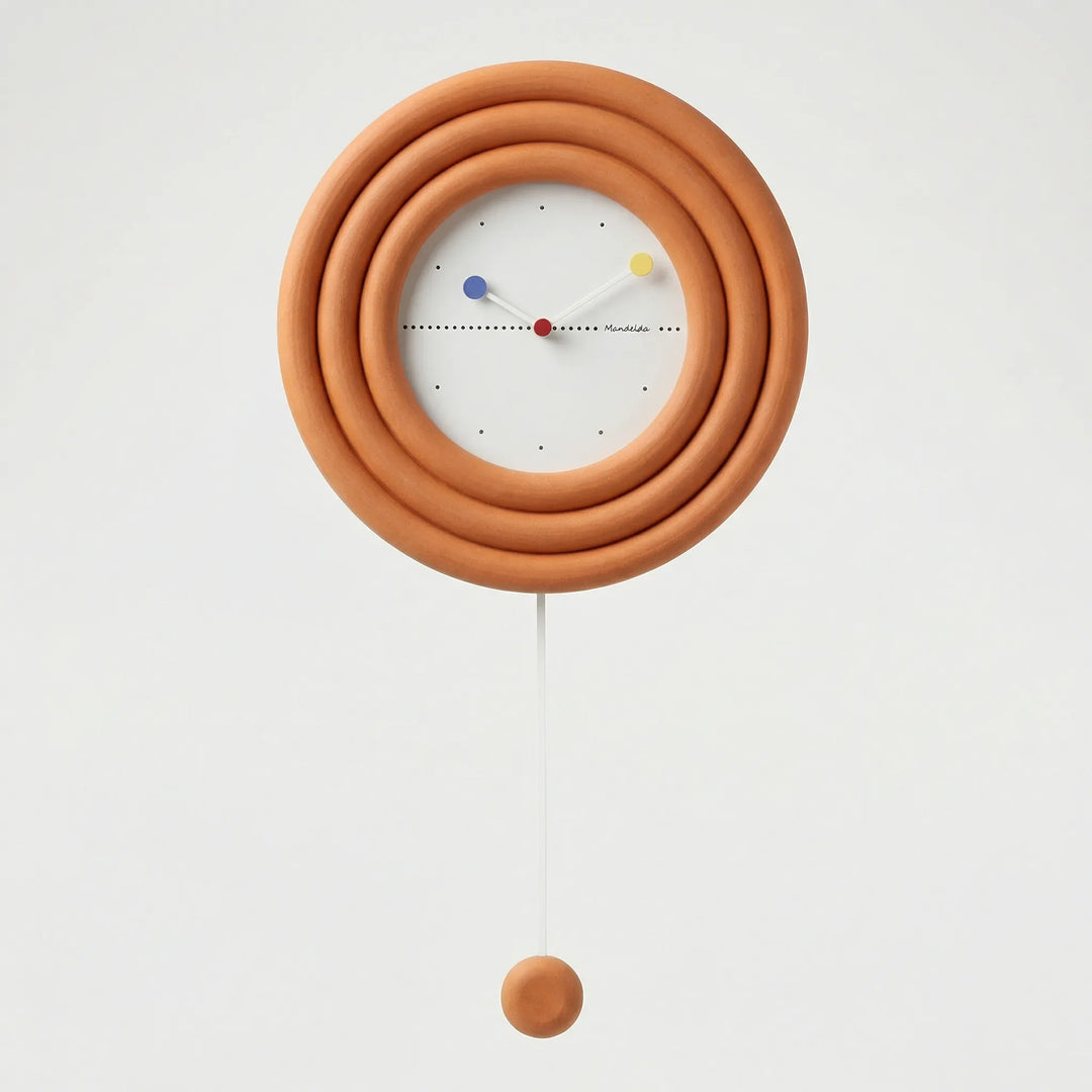 Silent minimalist round pendulum wall clock. Modern and contemporary decor piece for a serene home.