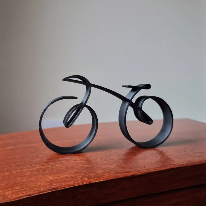 Collection of three minimalist bicycle sculptures, varied sizes, stylish black metal art home decor