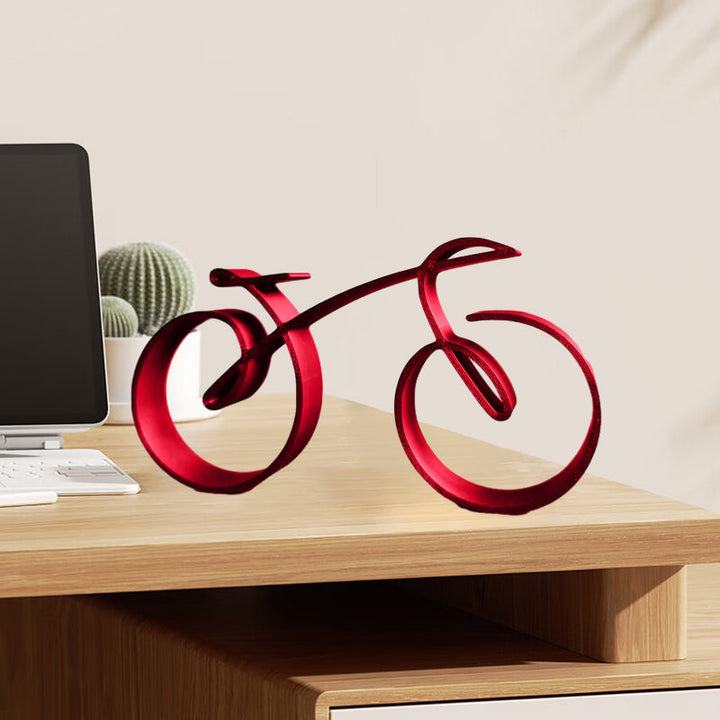 Minimalist black metal bicycle sculpture against a white background, clean and modern desk decor