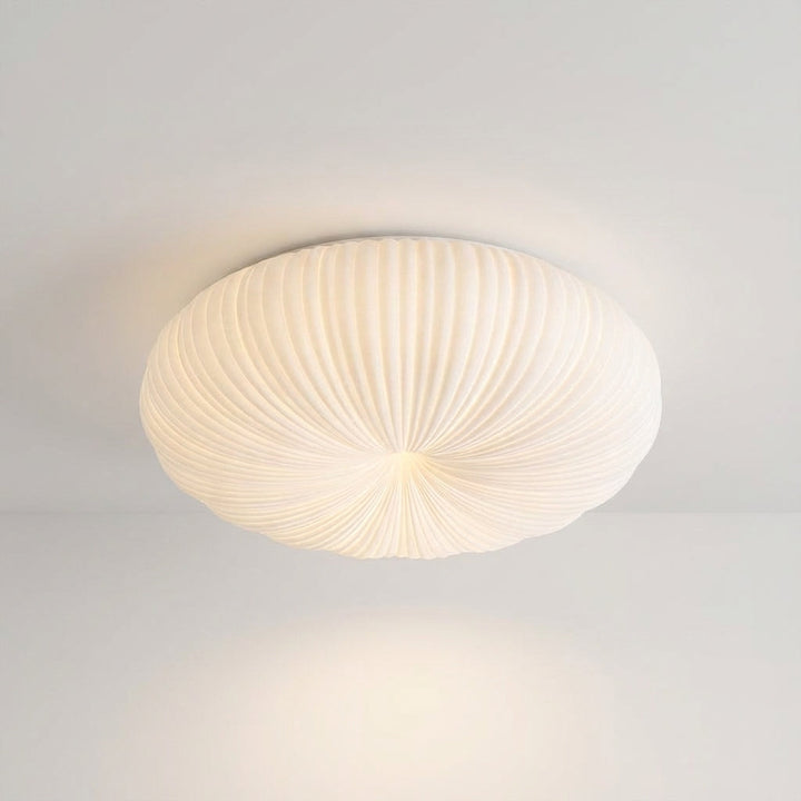 Contemporary Ciravine flush mount LED ceiling light illuminating a modern living room with soft, ambient glow.