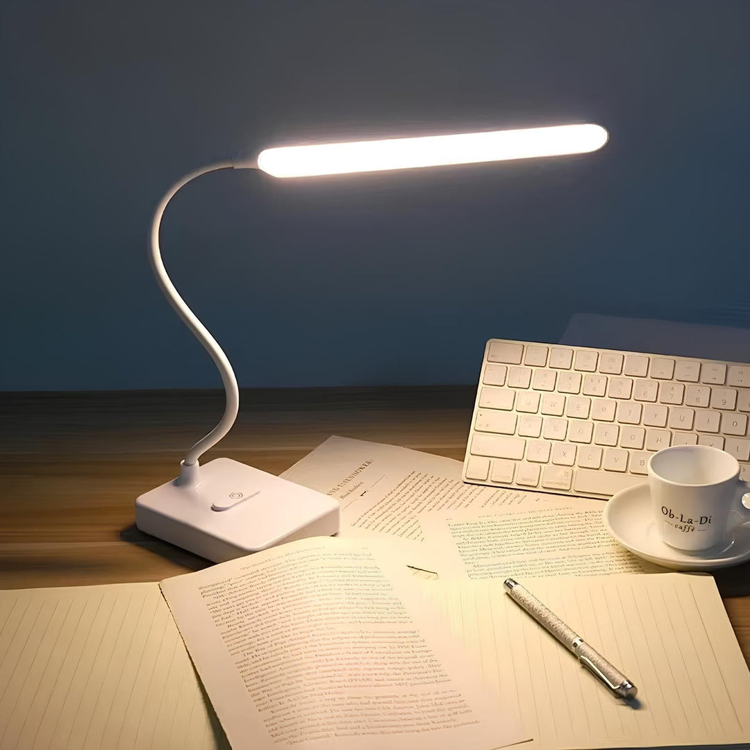 Sleek flexible LED task light, enhancing office or study with adjustable brightness & modern design.