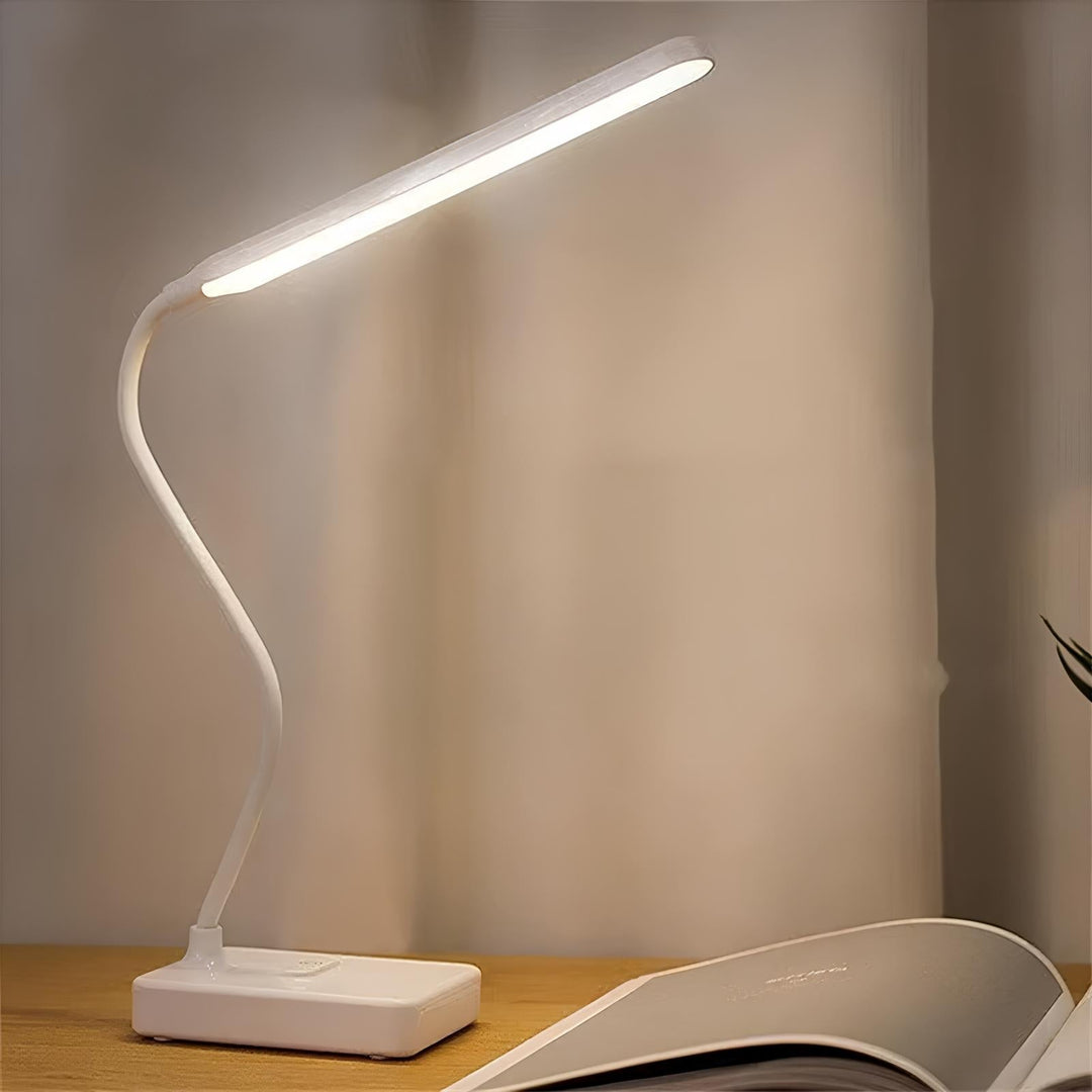 Energy-efficient modern LED desk lamp, flexible & dimmable, ideal for focused work or relaxed reading.