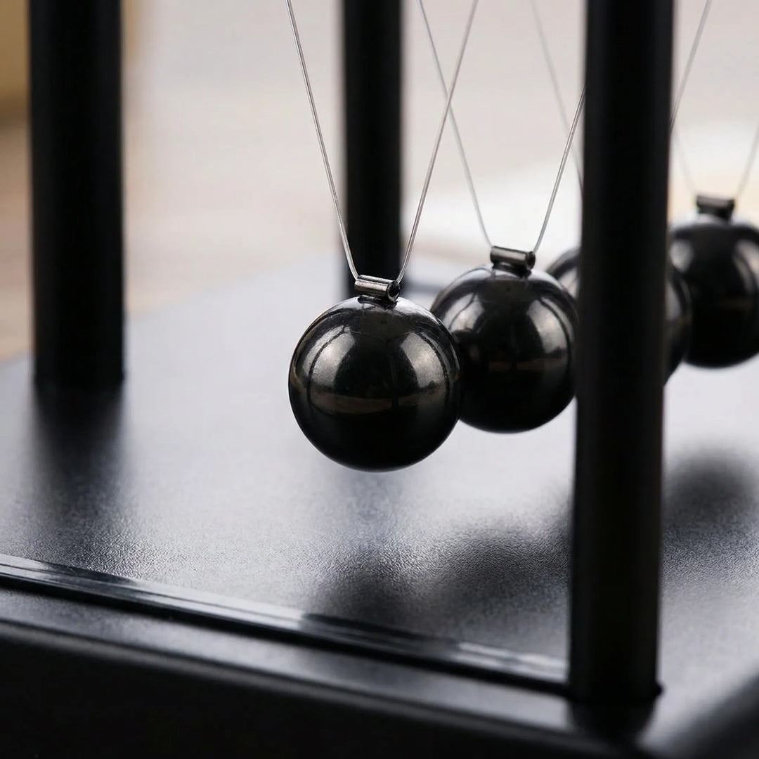 Zen kinetic desk ornament with magnetic movement. A modern tabletop sculpture for office decor, promoting focus & calm.