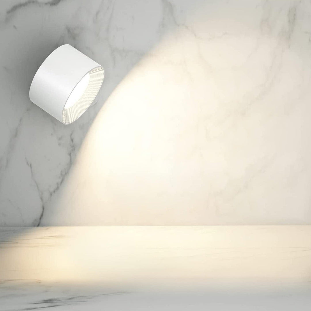 Rechargeable LED wall light, LumoFlex wireless & dimmable. Perfect for modern bedroom decor.