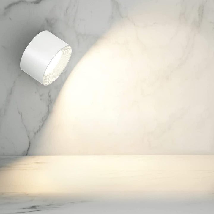 Rechargeable LED wall light, LumoFlex wireless & dimmable. Perfect for modern bedroom decor.