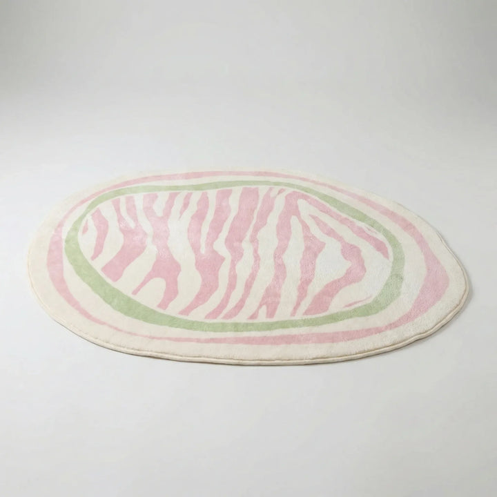 Flowique oval accent rug with abstract wavy stripes, perfect for modern bedroom or Scandinavian decor.