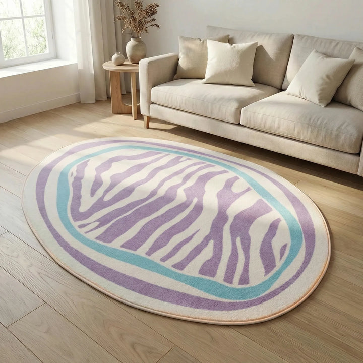 Abstract oval area rug, Flowique model, featuring unique striped waves for modern home decor.