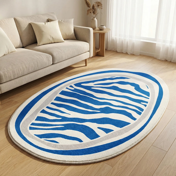 Decorative modern oval rug with captivating wavy stripes, an accent for bedroom or living room.