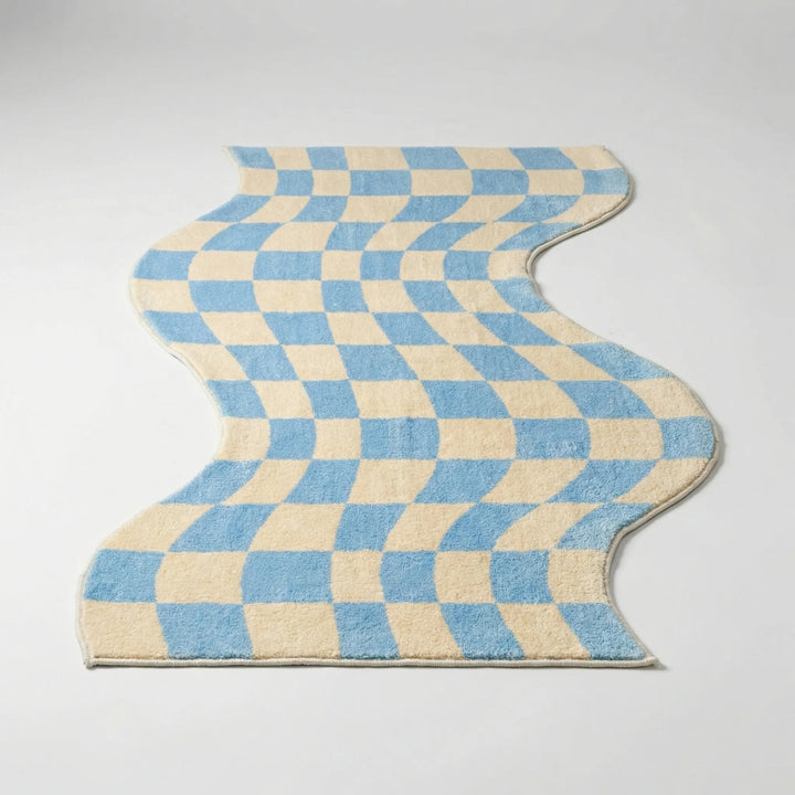 Statement wavy pastel area rug, modern floor mat with check pattern, adds cozy home decor.