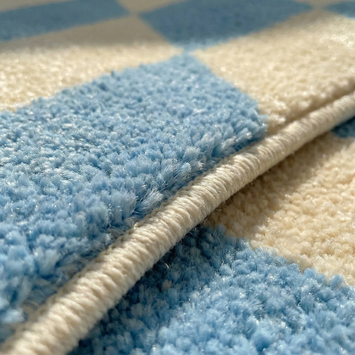 Flowique wavy pattern area rug, non-slip pastel floor mat for a modern living room design.