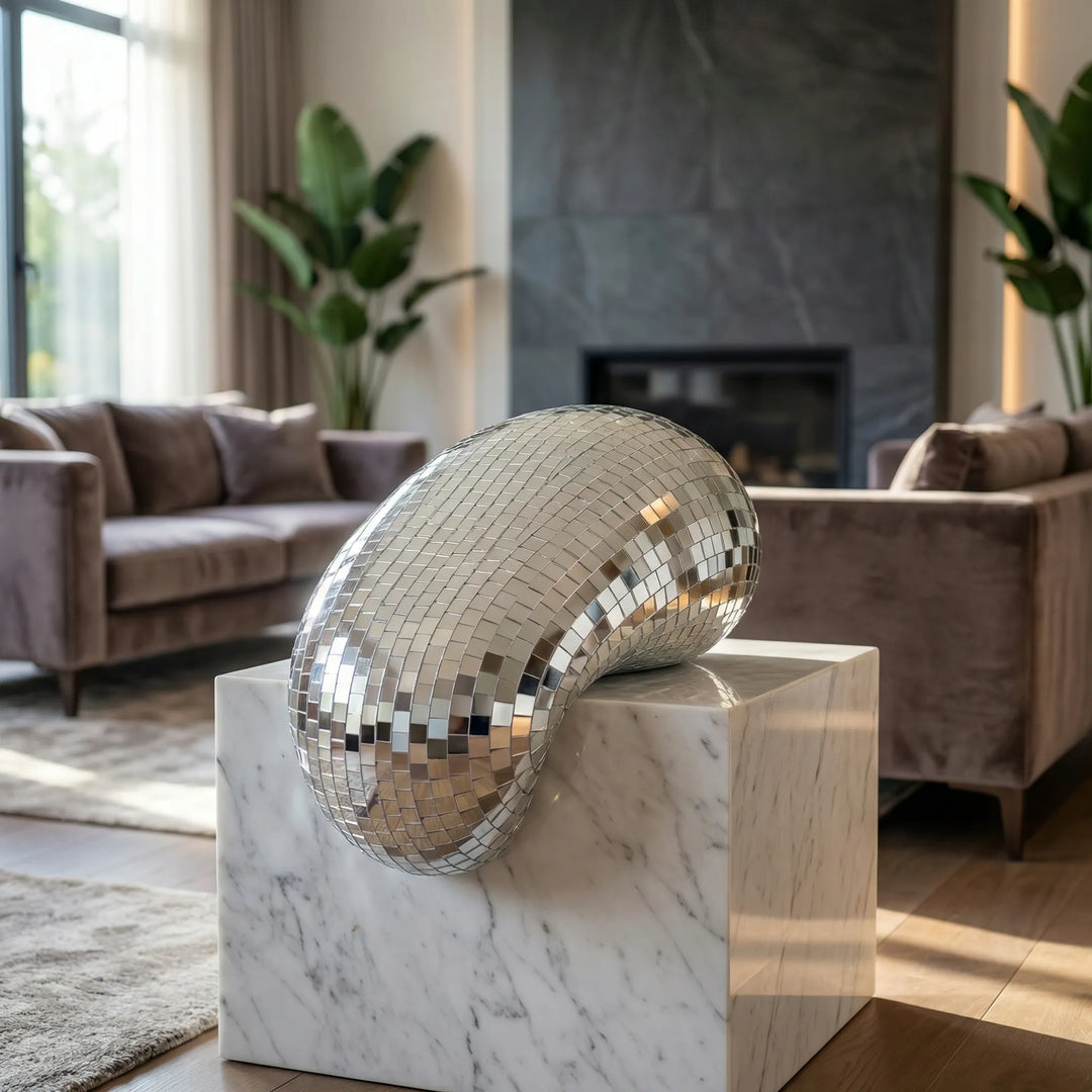 Modern reflective tabletop sculpture, a unique contemporary art piece for living room or office decor.