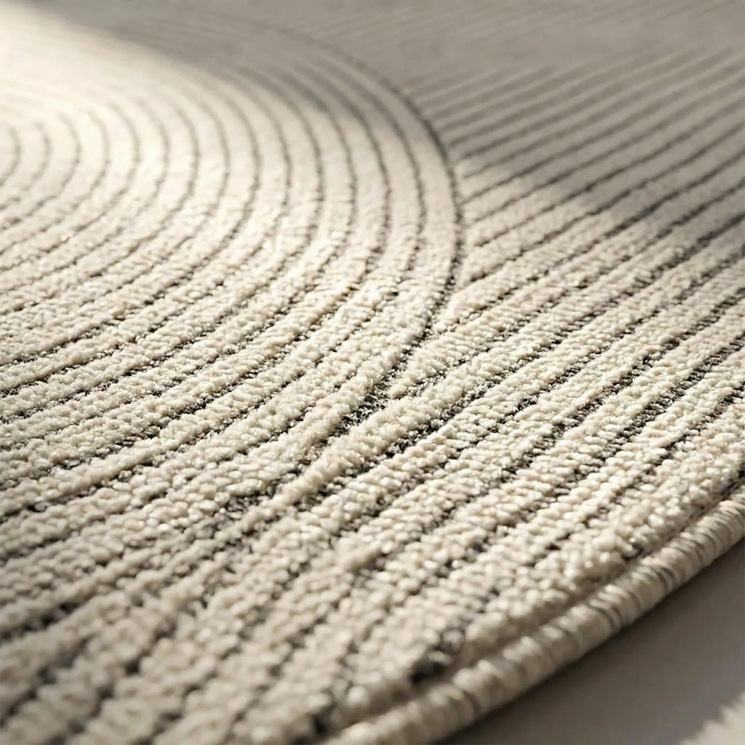 Statement modern round area rug featuring elegant Flowique wave pattern. Scandinavian style for versatile home decor.