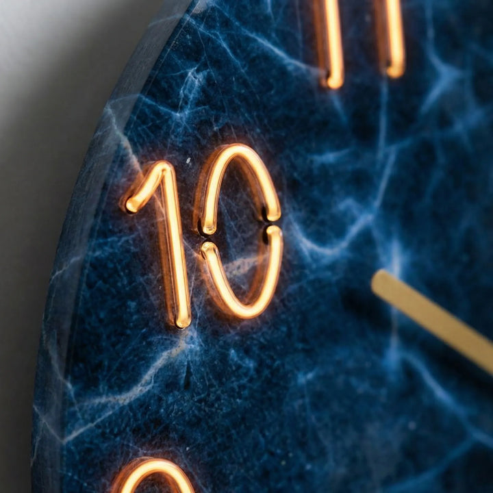Artistic modern round clock featuring unique patterns & soft illumination.