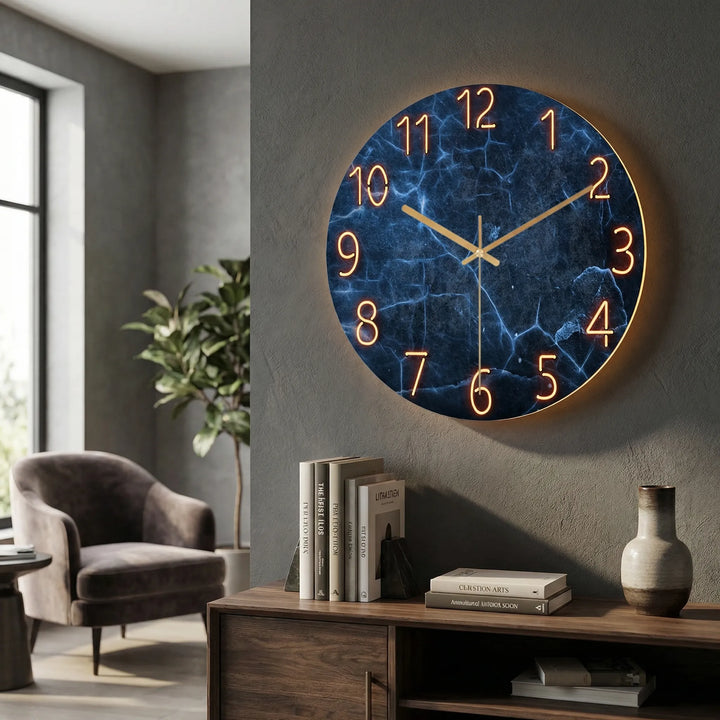 Minimalist battery-operated illuminated round wall clock for office or home.