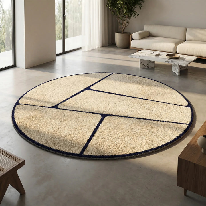 Modern round low pile area rug with flowing wave pattern. Ideal for contemporary home decor in living rooms.