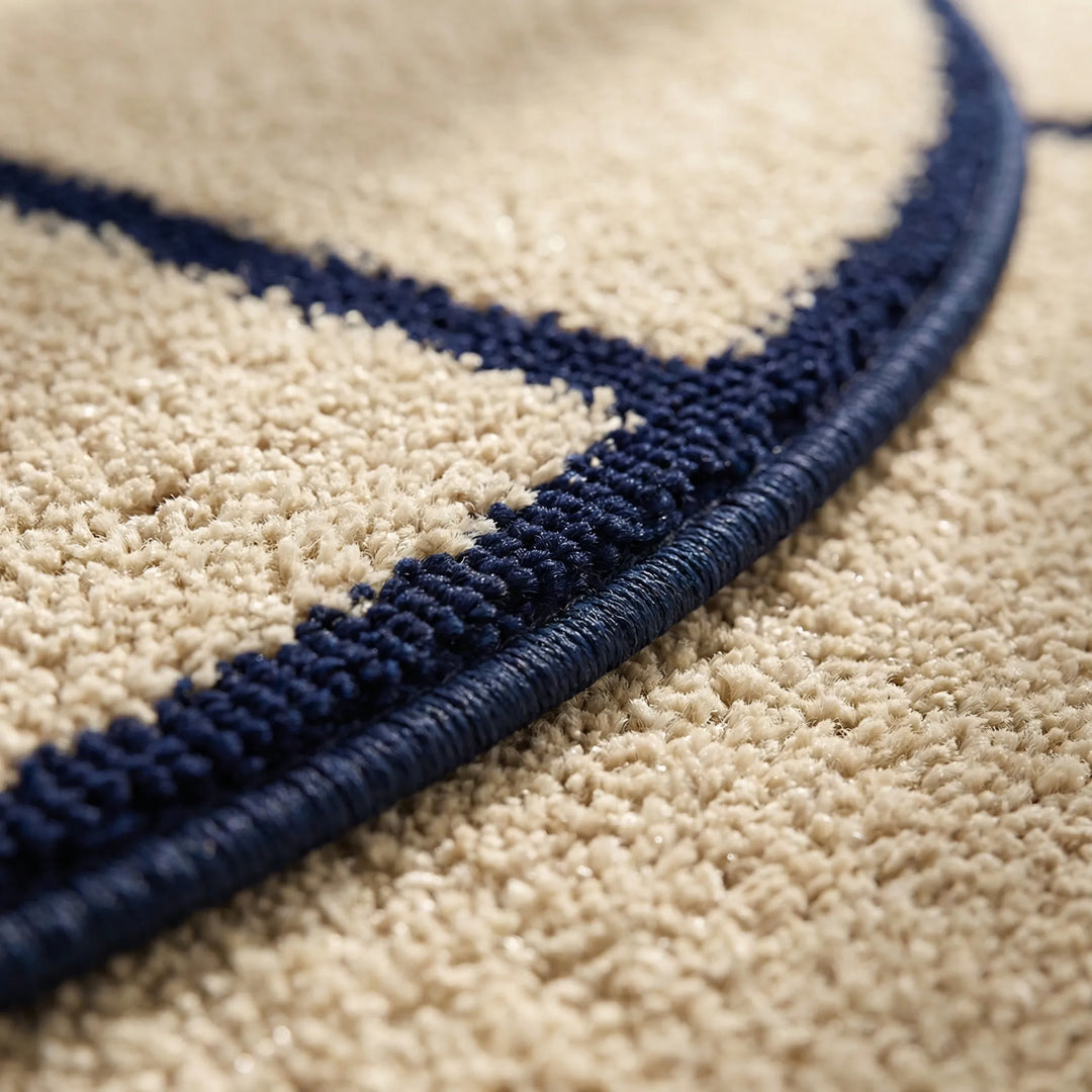 Stylish round low pile rug with dynamic wave design, a modern statement piece for any home living space.