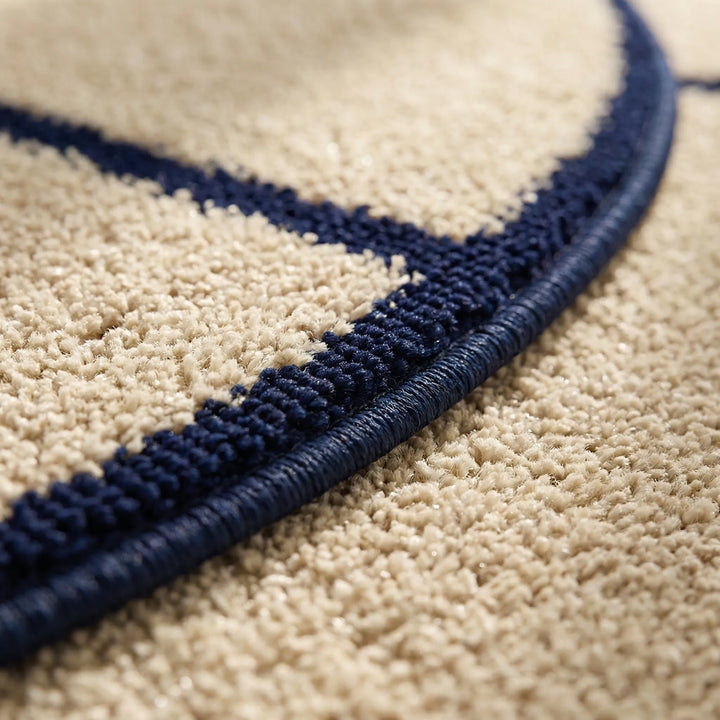 Stylish round low pile rug with dynamic wave design, a modern statement piece for any home living space.