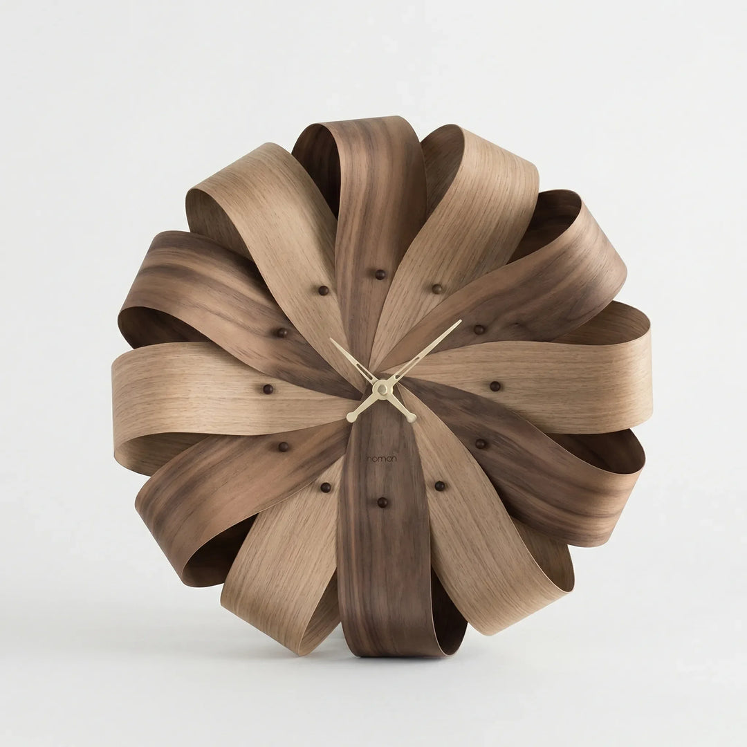 Decorative modern sculptural wall clock. Large, unique design, perfect for sophisticated home or office decor.