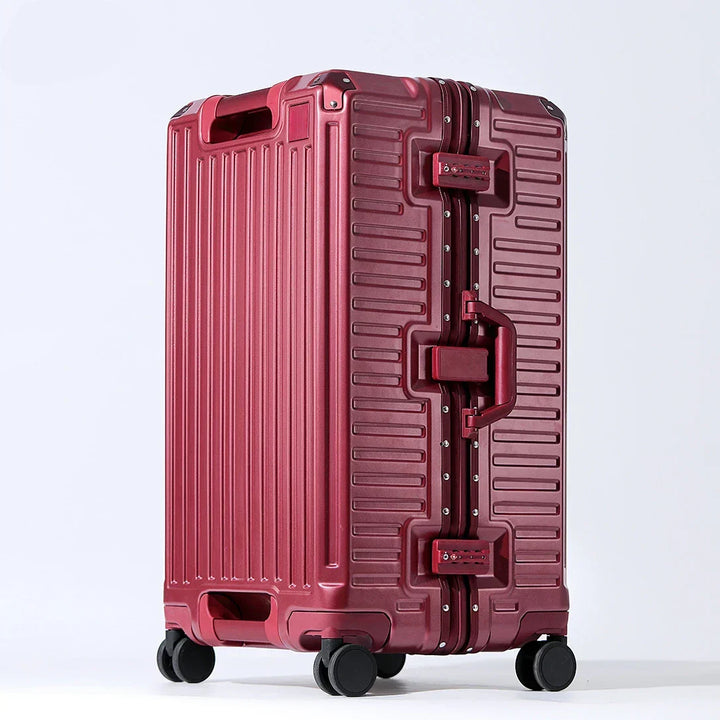 Modern unisex hardshell travel suitcase with wide grip handle & spinner wheels for easy mobility.