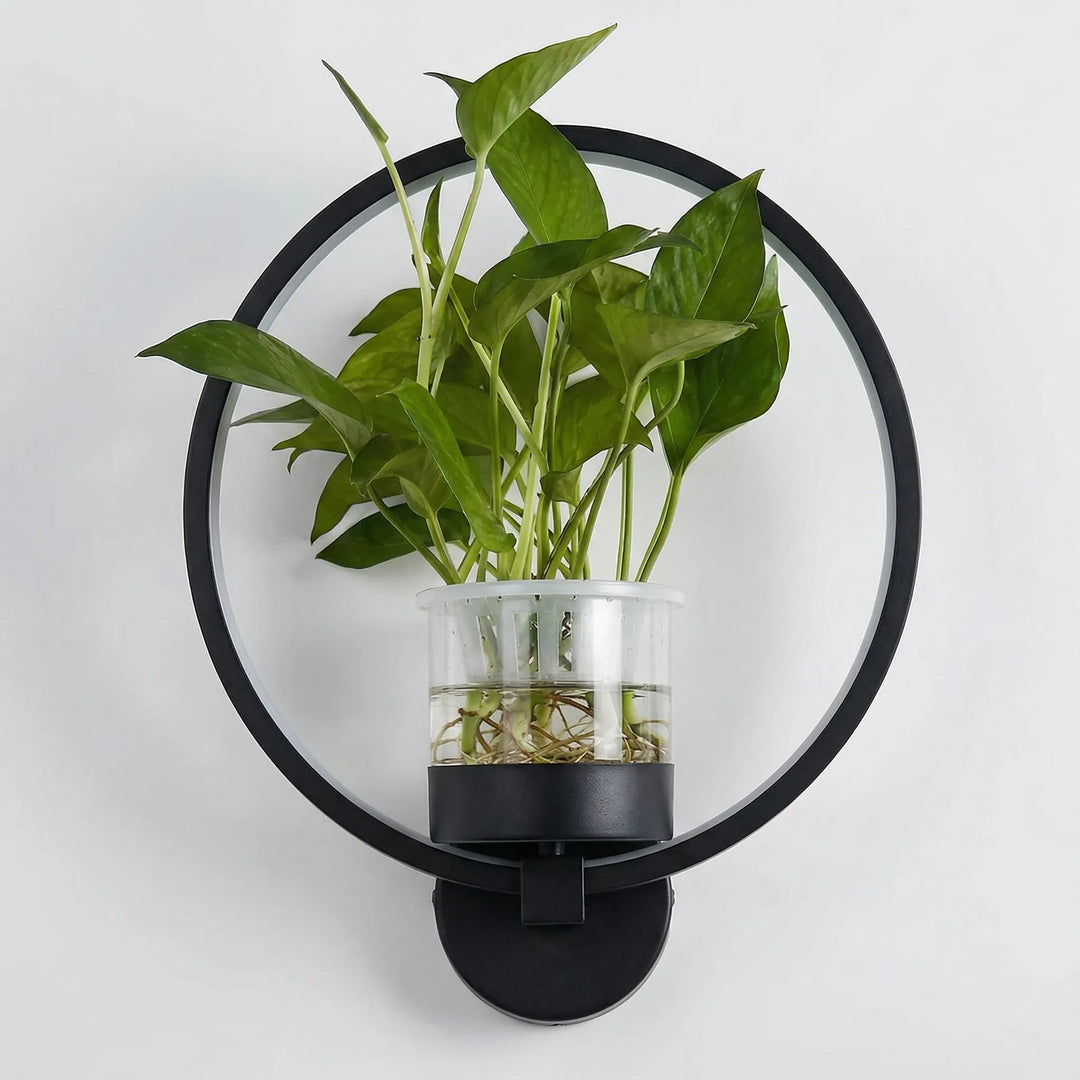 Stylish wall lamp featuring a plant holder, designed for modern ambient lighting in any room.