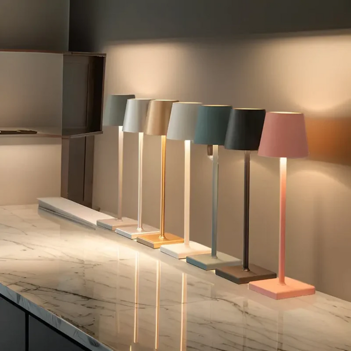 Contemporary wireless LED table lamp with dimmable light, enhancing indoor & outdoor spaces. Rechargeable.