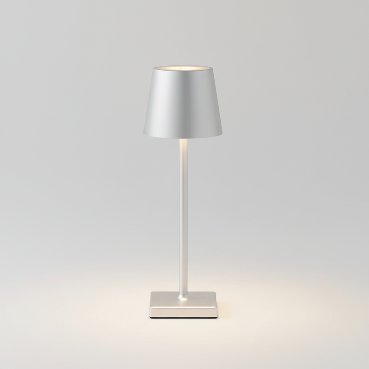 Dimmable LED table lamp, wireless & portable, casting soft ambient light for modern homes & patios.