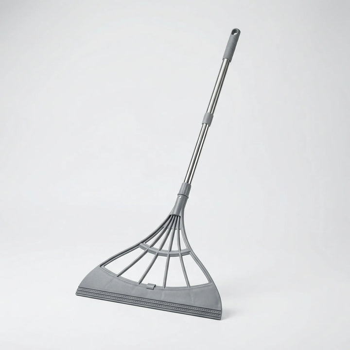 Adjustable handle multipurpose cleaning tool; works as a mop, sweeper, and squeegee for floors and carpets.