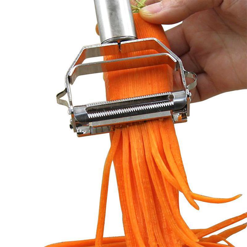 Hand holding a sleek stainless steel vegetable peeler & julienne slicer, perfect for healthy cooking.