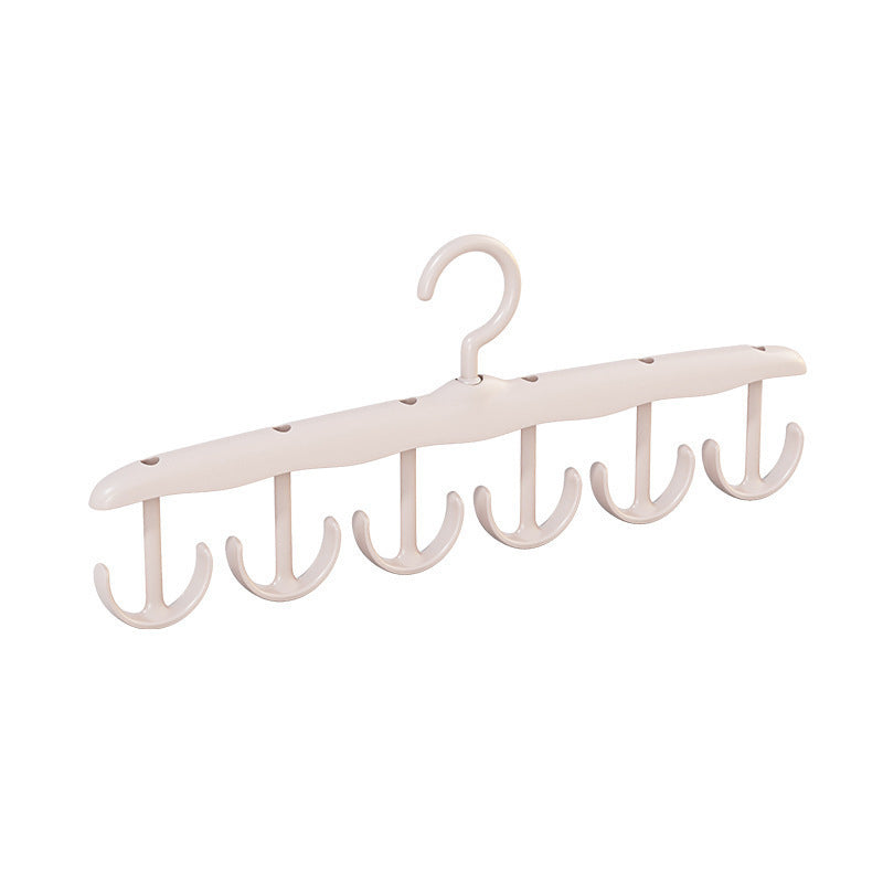 Versatile plastic clothes hanger with an adaptable rotating hook, maximizing storage utility