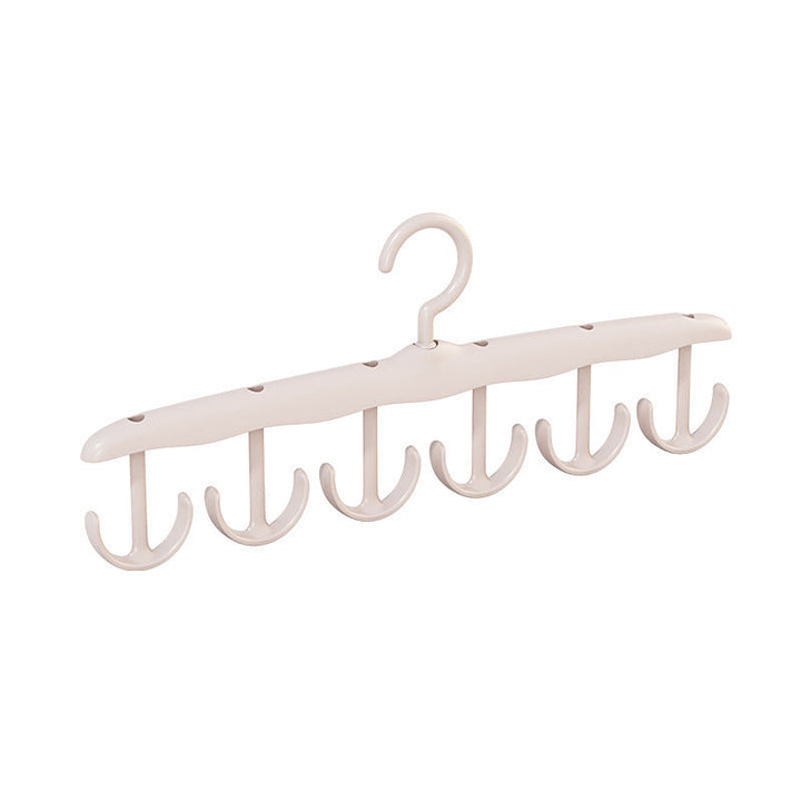 Versatile plastic clothes hanger with an adaptable rotating hook, maximizing storage utility