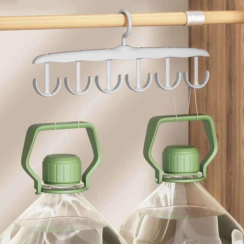 White plastic clothes hanger with a convenient rotating hook, essential for closet and laundry storage