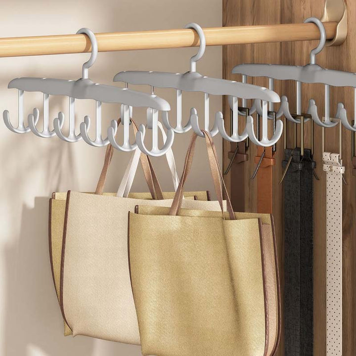 Compact plastic clothes hanger, designed for efficient garment storage with a smooth rotating hook