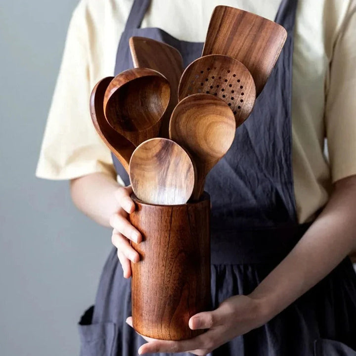 Close-up of smooth natural teak wood kitchen utensils, highlighting grain, durability & ergonomic design.