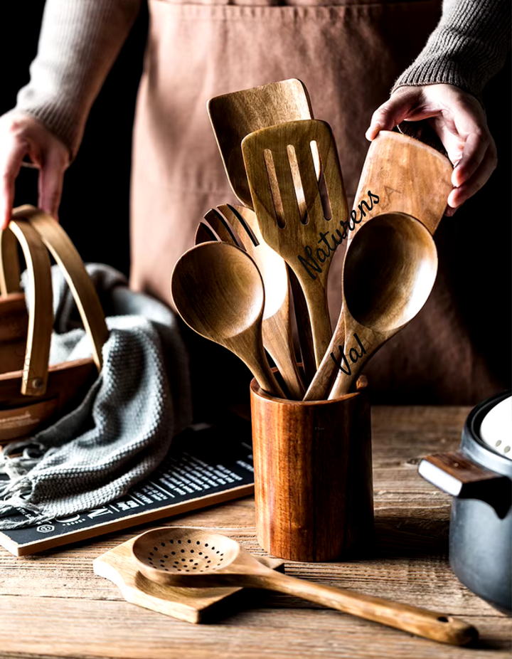 Complete natural teak wood kitchen utensil set. Sustainable, versatile cooking tools for modern home chefs.