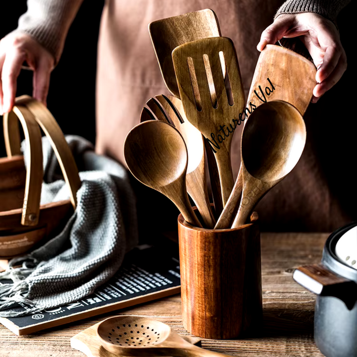 Beautiful natural teak wood kitchen utensils with smooth finish. Eco-friendly, sustainable cooking tools.