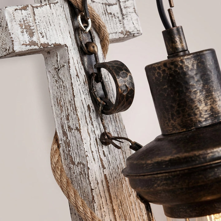 Elegant nautical anchor wall sconce, provides ambient LED lighting for coastal & maritime home decor.