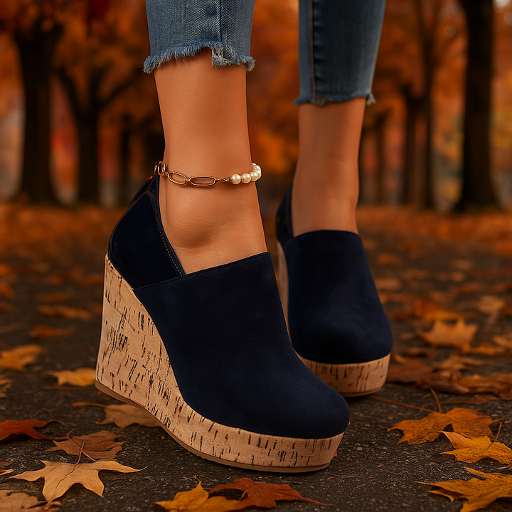 Close-up of the comfortable wedge sole on navy blue women's orthopedic loafers