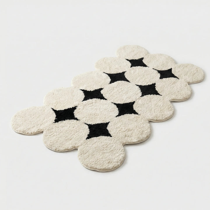 Plush Flowique bath mat, super soft & absorbent. Features non-slip backing for safety & comfort in any bathroom.
