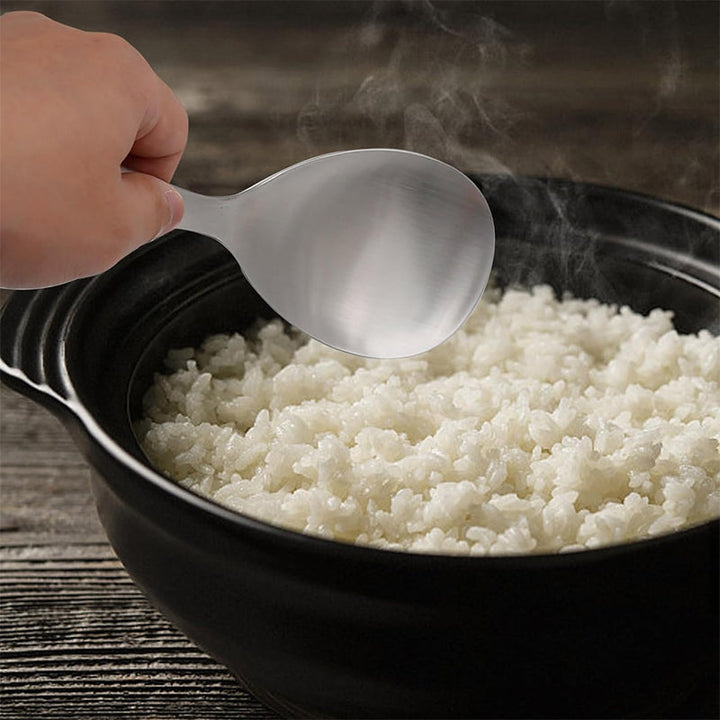 Stainless steel rice serving spoon with non-stick surface, essential cooking utensil