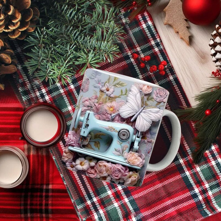 White ceramic coffee cup with intricate 3D sewing tool decorations, a great novelty quilter's gift.