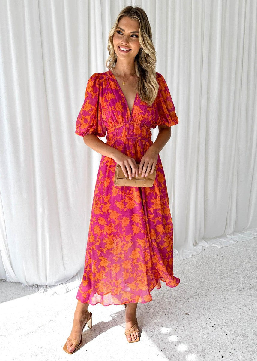 Flattering women's floral midi dress with puff sleeves & v-neck. Ideal for special occasions, parties or summer guests.