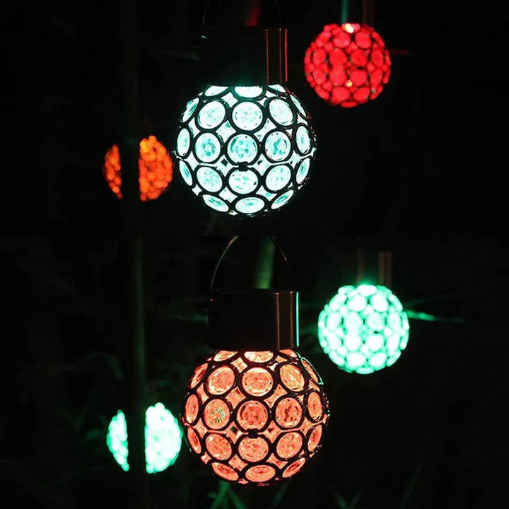 Outdoor Solar Hanging Lantern illuminating a garden path at dusk, waterproof LED lighting.