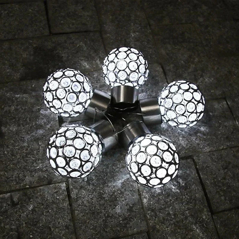 Detail of the LED filament inside a solar hanging lantern, providing bright and efficient outdoor lighting.